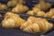 Freshly baked golden brown French croissants