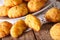 Freshly baked gougere buns with cheese close-up. Horizontal