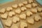 Freshly baked heart-shaped oatmeal cookies baking tray