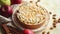 Freshly baked homemade apple pie with almond flakes cake on yellow