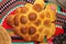 Freshly baked homemade bread arranged in traditional Bulgarian textiles. Image of some tasty Home-made bakery products.