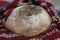 Freshly baked homemade bread arranged in traditional Bulgarian textiles. Image of some tasty Home-made bakery products.