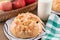 Freshly baked, homemade sweet cake with almonds and raisins on wooden table. Easter loaf. Basket with pears and apples. Vintage