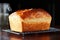 a freshly baked loaf of bread cooling on a wire rack