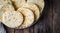 Freshly baked Moroccan mini flatbread - batbouts on wooden table. Selective focus. Arabian food