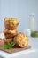 Freshly baked muffins with spinach, sweet potatoes and feta cheese on white background. Healthy food concept. Savory pastry