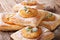 Freshly baked puff pastry pies with pineapple close-up. horizontal