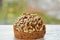Freshly baked raisins cake with sunflower seeds isolated on white wooden board. Healthy vegetarian muffin on blurred background