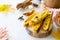 Freshly baked raisins and cinnamon biscotti and a cup of cappuccino coffee on a gray slate or slate background