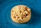 Freshly baked single portion apple pie on a blue porcelain plate