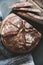 Freshly baked sourdough bread on wooden board, close-up