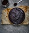 Freshly baked sponge cake with cocoa on the grey concrete backdrop