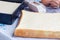 Freshly baked square sponge cake, ingredients on background, horizontal