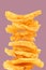 Freshly baked stack of deep ridged potato chips