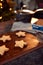 Freshly Baked Star Shaped Christmas Cookies On Board Ready For Decoration