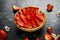 Freshly baked Strawberry custard tarts on wooden tray with camomiles, summer theme