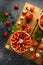 Freshly baked Strawberry custard tarts on wooden tray with camomiles, summer theme