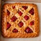 Freshly baked strawberry pie in a brown cardboard box