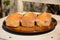 The freshly baked sweet mini loaves on rustic wooden background.