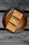 The freshly baked sweet mini loaves on rustic wooden background.