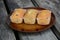 The freshly baked sweet mini loaves on rustic wooden background.