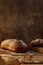 Freshly baked wheat bread, homemade cakes, still life with bread, crisp loaf of bread, still life on a rustic background, top view