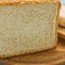 Freshly baked white bread close-up. Golden crust, porous flesh.