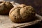 Freshly Baked Whole Wheat Grain Kaiser Roll Round Breads with Sack.