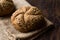 Freshly Baked Whole Wheat Grain Kaiser Roll Round Breads with Sack.