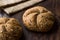 Freshly Baked Whole Wheat Grain Kaiser Roll Round Breads with Sack.