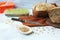 Freshly baked yeast-free homemade bread, container with sprouted wheat grains, on a linen napkin, on the table