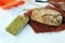 Freshly baked yeast-free homemade bread, container with sprouted wheat grains, on a linen napkin, on the table