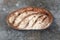 Freshly bread on gray kitchen table.