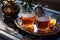 Freshly brewed black tea in turkish glasses in oriental tray