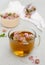 Freshly brewed herbal clover tea in glass mug, closeup view