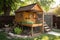 freshly built chicken coop with open door in backyard