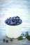 Freshly collected blueberries in the metal tin mug.