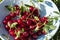 Freshly collected red cherries in the ceramic bowl.