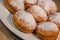 Freshly cooked Apricot jam doughnuts, referred to as jelly doughnuts, donuts in the US