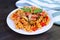 Freshly Cooked Fusilli Pasta in Tomato Sauce on Kitchen Table