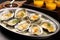 freshly cooked grilled oysters with garlic sauce
