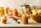 Freshly cooked homemade applesauce in glass jars, ingredients, plate, utensils on kitchen table, closeup view