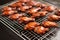 freshly cooked honey bbq wings cooling on a wire rack