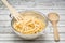 Freshly cooked linguine in a stainless steel colander