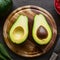 Freshly cut avocado displayed on a wooden cutting board