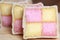 Freshly cut Battenberg Cake slices with pink and yellow sponge covered in marzipan
