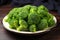 freshly cut broccoli florets on a plate