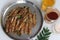 Freshly cut, cleaned and marinated anchovy fish presented on a steel plate