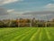 Freshly cut grass on a training pitch for Irish National sport camogie, hurling, rugby and Gaelic football and tall goal posts.