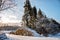 Freshly cut logs and firewood from loggers submerged under a blanket of white snow during the winter season